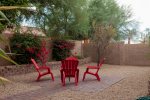 Private backyard with sitting area and mature citrus trees